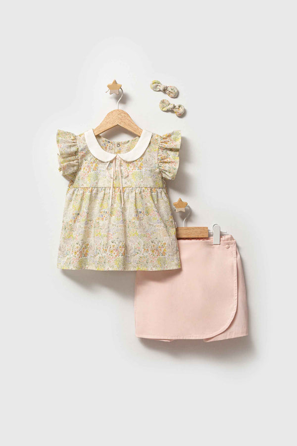 Completo bimba blusa floreale e gonna-pantaloncino con mollettine