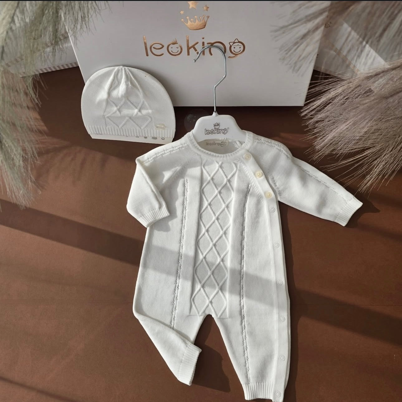 White Knit Baby Romper - Elegance and Sweetness for Your Little One